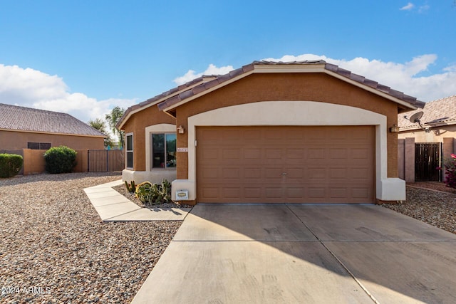 ranch-style house featuring a garage