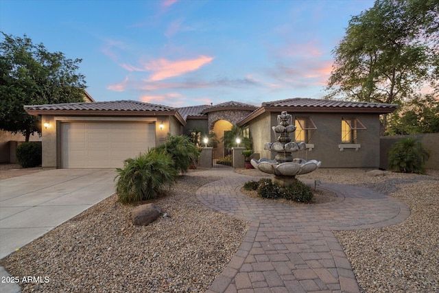 3350 S Holguin Way, Chandler, AZ 85248 - mediterranean / spanish home featuring driveway, a garage, stucco siding, and a tile roof