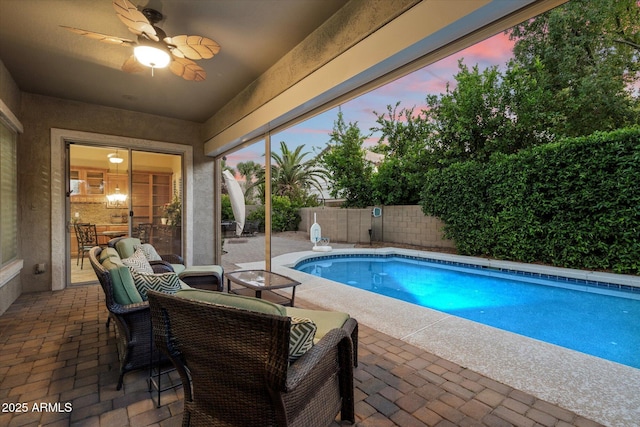3350 S Holguin Way, Chandler, AZ 85248 - pool at dusk featuring a patio, a fenced backyard, and a ceiling fan