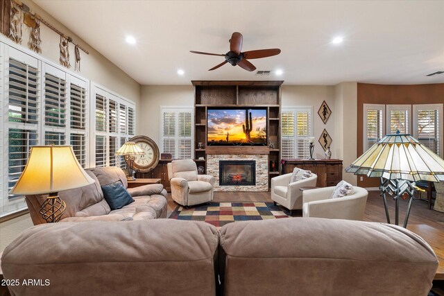 3350 S Holguin Way, Chandler, AZ 85248 - living area featuring a ceiling fan, wood finished floors, recessed lighting, and a stone fireplace