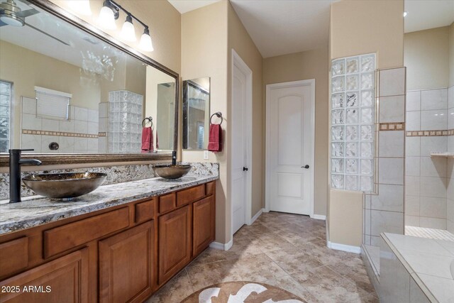 3350 S Holguin Way, Chandler, AZ 85248 - full bathroom with walk in shower, double vanity, tile patterned floors, and baseboards