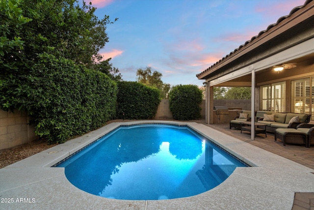 3350 S Holguin Way, Chandler, AZ 85248 - pool at dusk with outdoor lounge area, a fenced backyard, and a patio area