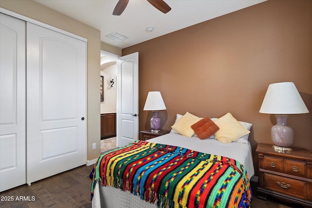 3350 S Holguin Way, Chandler, AZ 85248 - bedroom featuring dark wood-style flooring, a closet, ceiling fan, and baseboards