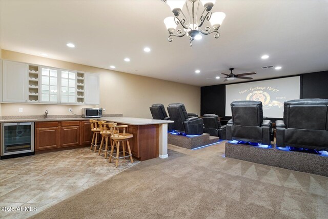 3350 S Holguin Way, Chandler, AZ 85248 - home theater room with beverage cooler, recessed lighting, bar with sink, ceiling fan, and a chandelier