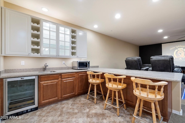 3350 S Holguin Way, Chandler, AZ 85248 - indoor bar with wine cooler, stainless steel microwave, and recessed lighting