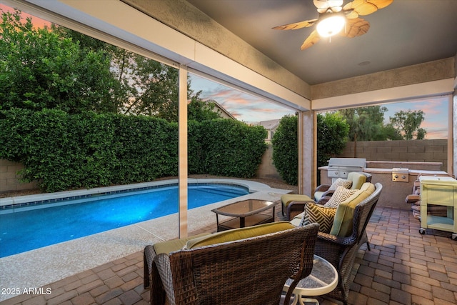 3350 S Holguin Way, Chandler, AZ 85248 - pool at dusk featuring a fenced backyard, ceiling fan, and a patio