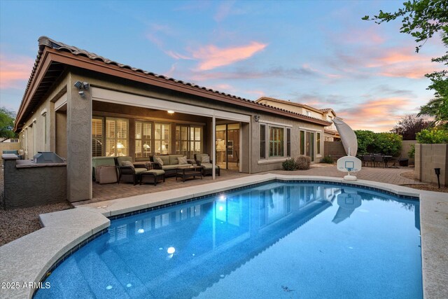 3350 S Holguin Way, Chandler, AZ 85248 - rear view of house with an outdoor hangout area, a patio area, an outdoor pool, stucco siding, and area for grilling
