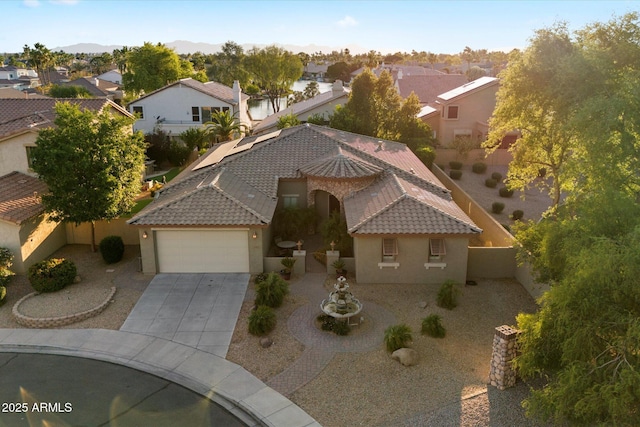 3350 S Holguin Way, Chandler, AZ 85248 - view of front of home featuring stucco siding, a residential view, an attached garage, and a tile roof