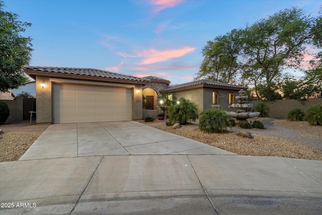 3350 S Holguin Way, Chandler, AZ 85248 - mediterranean / spanish-style home with stucco siding, driveway, an attached garage, and a tiled roof