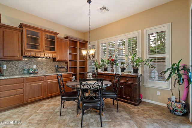 3350 S Holguin Way, Chandler, AZ 85248 - dining room featuring a chandelier and baseboards