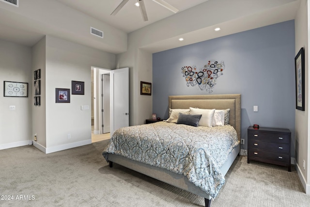 bedroom with ceiling fan and light colored carpet