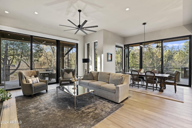 living room featuring a chandelier and light hardwood / wood-style floors