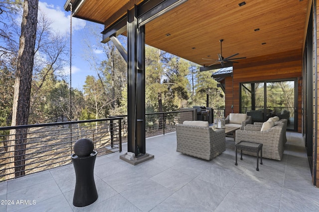 view of patio / terrace with ceiling fan, a balcony, and an outdoor hangout area