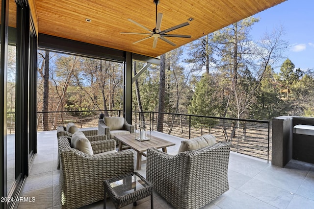 view of patio with a balcony and ceiling fan