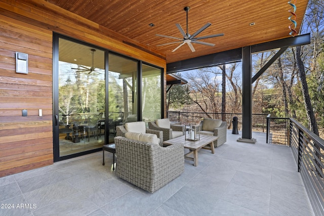 view of patio featuring an outdoor living space and ceiling fan