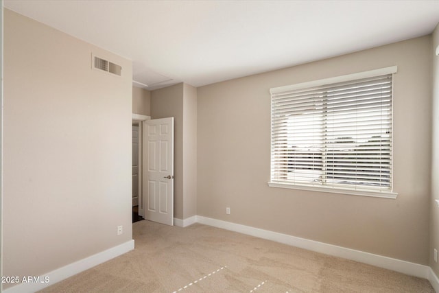 unfurnished bedroom with baseboards, visible vents, and carpet flooring