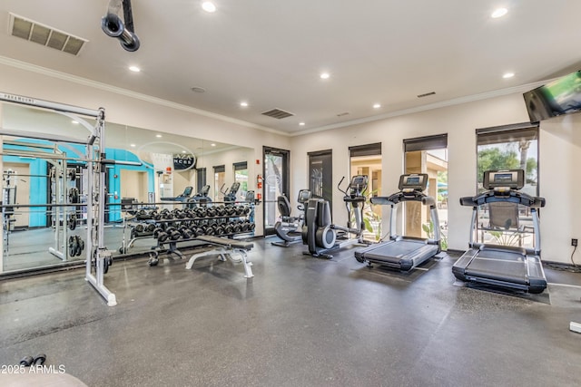 exercise room featuring ornamental molding, visible vents, and recessed lighting