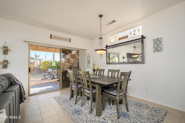 dining space with light tile patterned floors