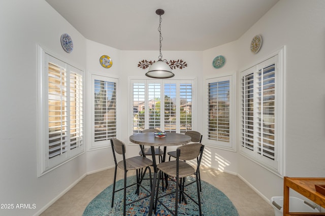 dining area with light tile patterned floors