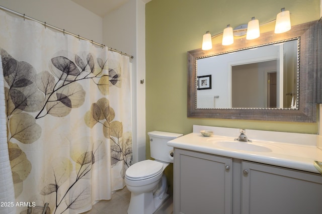 bathroom featuring vanity, a shower with shower curtain, tile patterned floors, and toilet