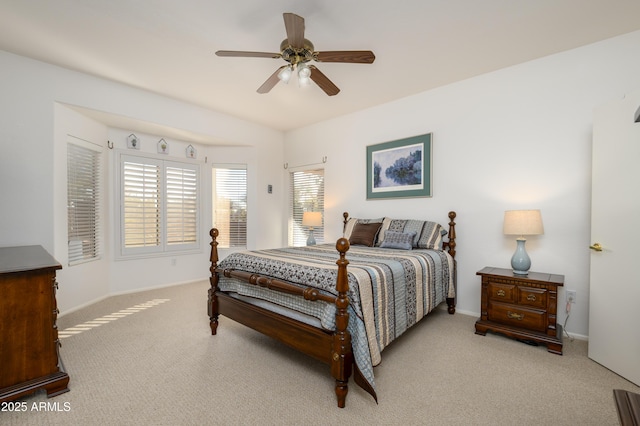 bedroom with light colored carpet and ceiling fan