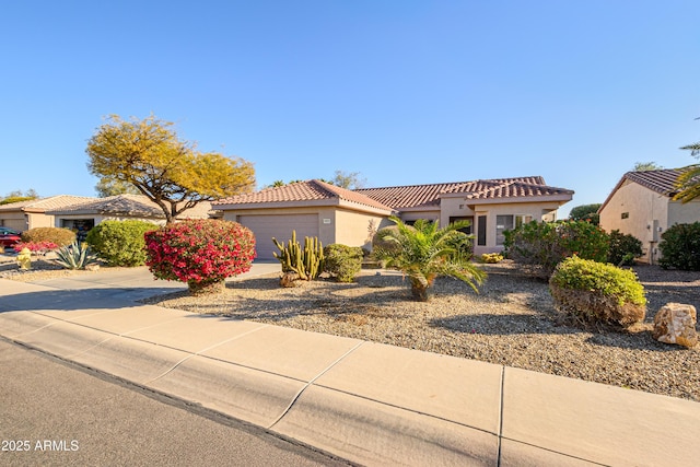 mediterranean / spanish-style home featuring a garage