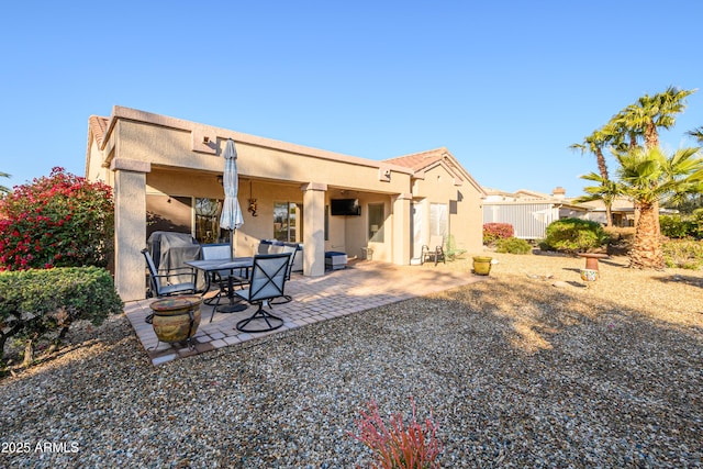 back of house featuring a patio area