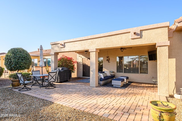 view of patio / terrace with ceiling fan and area for grilling