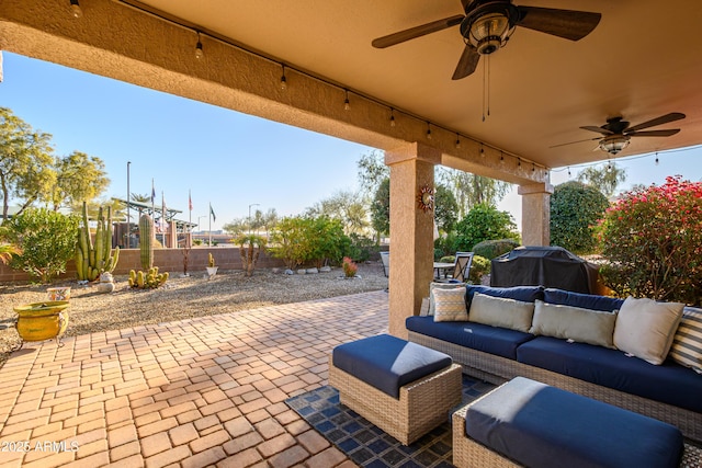 view of patio featuring grilling area, outdoor lounge area, and ceiling fan