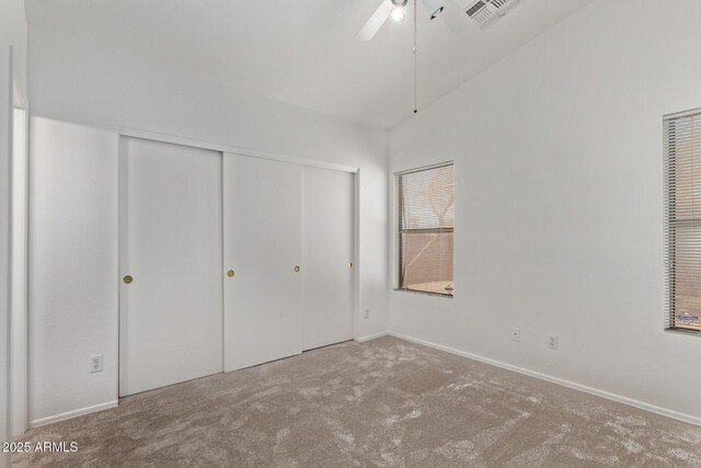 330 S Valley Dr, Apache Junction, AZ 85120 - unfurnished bedroom featuring carpet flooring, a closet, baseboards, vaulted ceiling, and ceiling fan