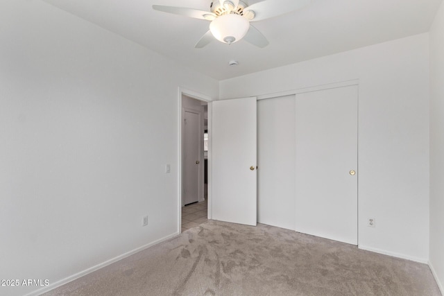 330 S Valley Dr, Apache Junction, AZ 85120 - unfurnished bedroom with carpet flooring, a closet, a ceiling fan, and baseboards