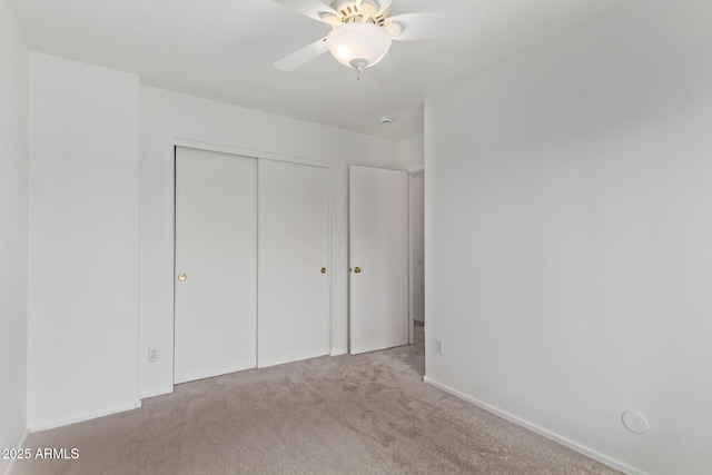 330 S Valley Dr, Apache Junction, AZ 85120 - unfurnished bedroom featuring carpet, a closet, baseboards, and a ceiling fan