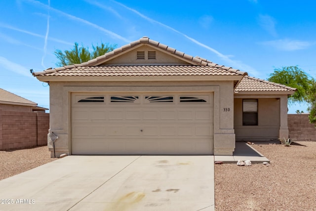 330 S Valley Dr, Apache Junction, AZ 85120 - view of front of house with a tiled roof, driveway, stucco siding, and an attached garage
