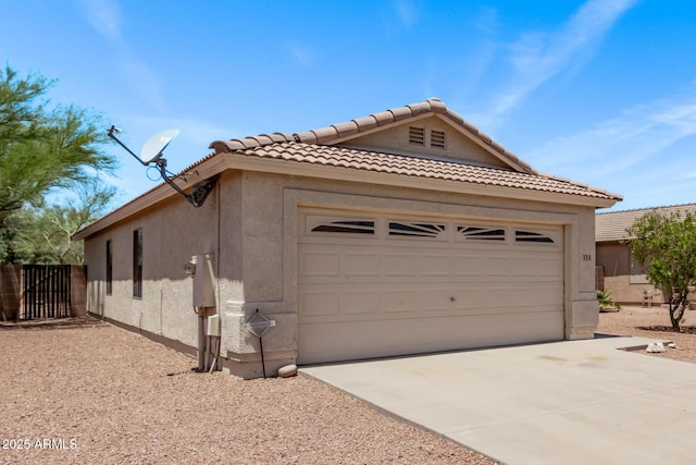 330 S Valley Dr, Apache Junction, AZ 85120 - view of front of property featuring a garage, stucco siding, concrete driveway, and a tiled roof