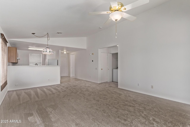 330 S Valley Dr, Apache Junction, AZ 85120 - unfurnished living room featuring vaulted ceiling, light colored carpet, ceiling fan, and baseboards