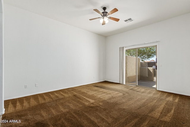 carpeted empty room featuring ceiling fan