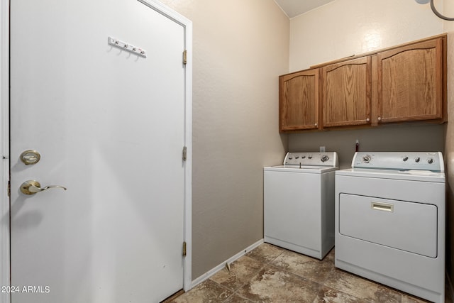 laundry area featuring cabinets and separate washer and dryer