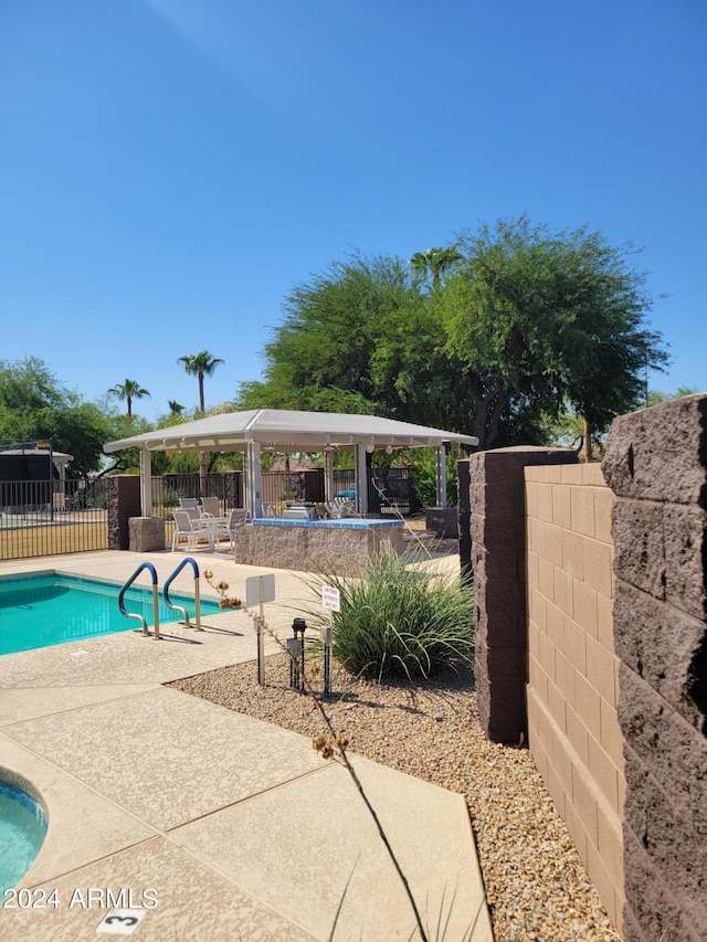 view of pool featuring a patio