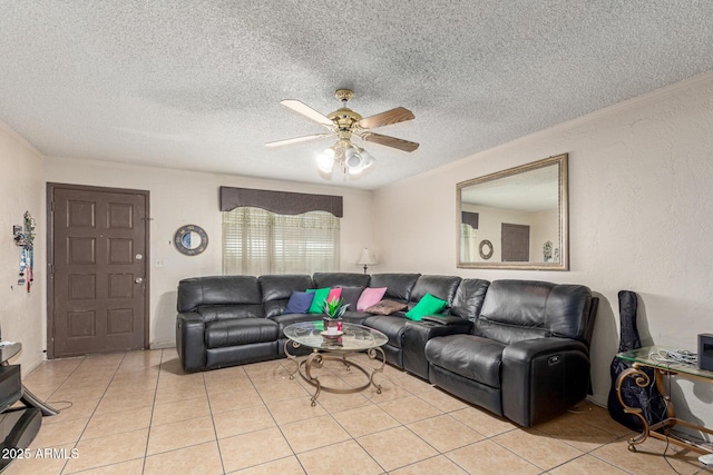 tiled living room featuring crown molding, ceiling fan, and a textured ceiling