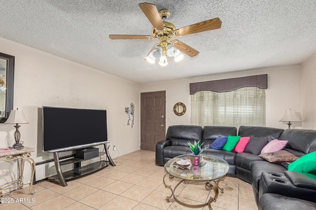 tiled living room featuring ceiling fan, ornamental molding, and a textured ceiling