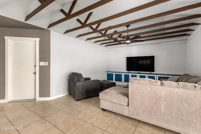 living room with lofted ceiling with beams, ceiling fan, and light tile patterned floors