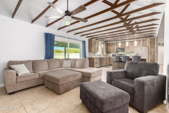 tiled living room with beam ceiling and ceiling fan