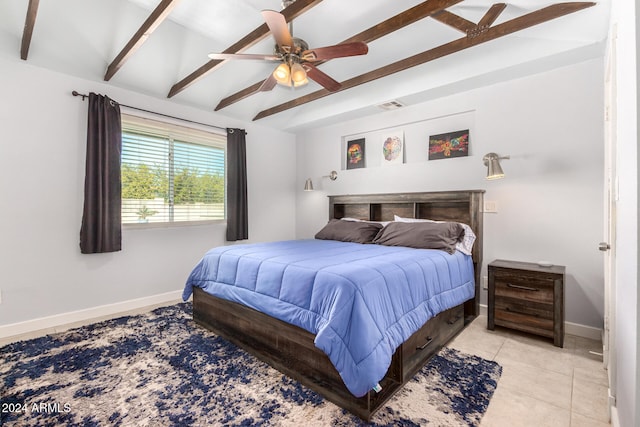 bedroom featuring light tile patterned floors, beamed ceiling, and ceiling fan