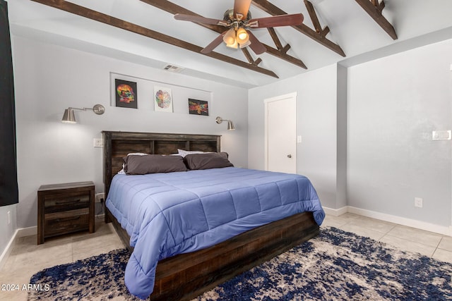 tiled bedroom featuring vaulted ceiling with beams and ceiling fan