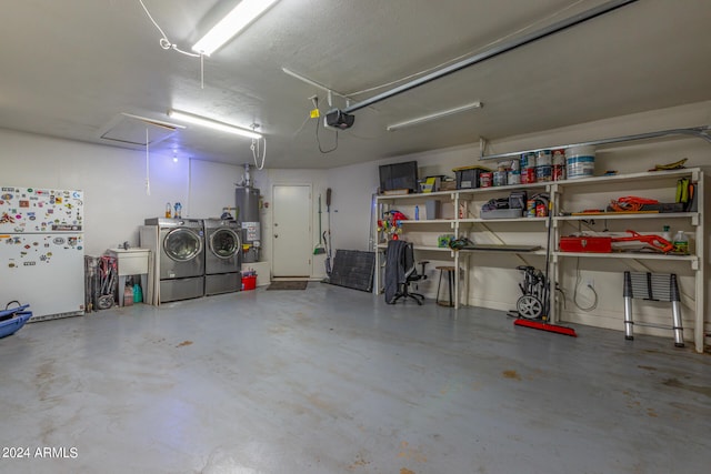 garage with water heater, independent washer and dryer, a garage door opener, and white fridge