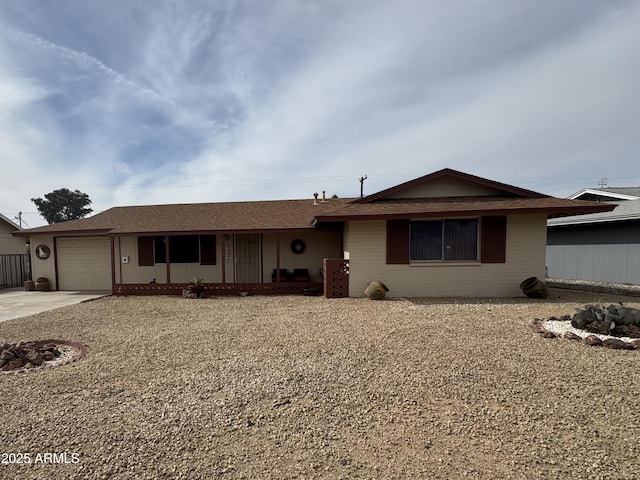 single story home with a garage and driveway