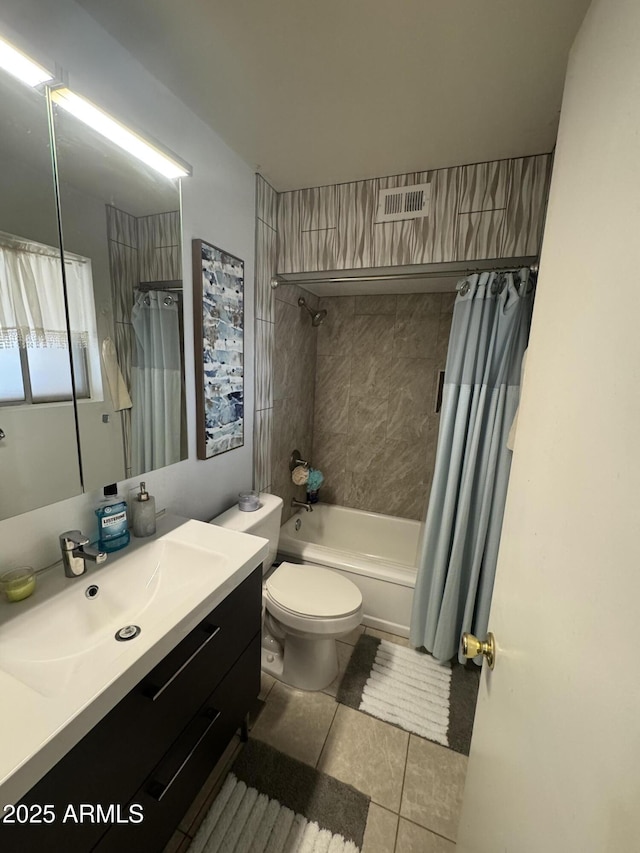 bathroom with toilet, tile patterned floors, shower / bathtub combination with curtain, and vanity