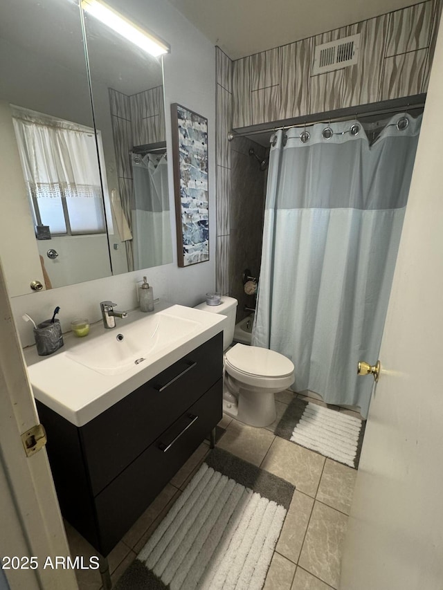 bathroom featuring toilet, tile patterned floors, visible vents, and vanity