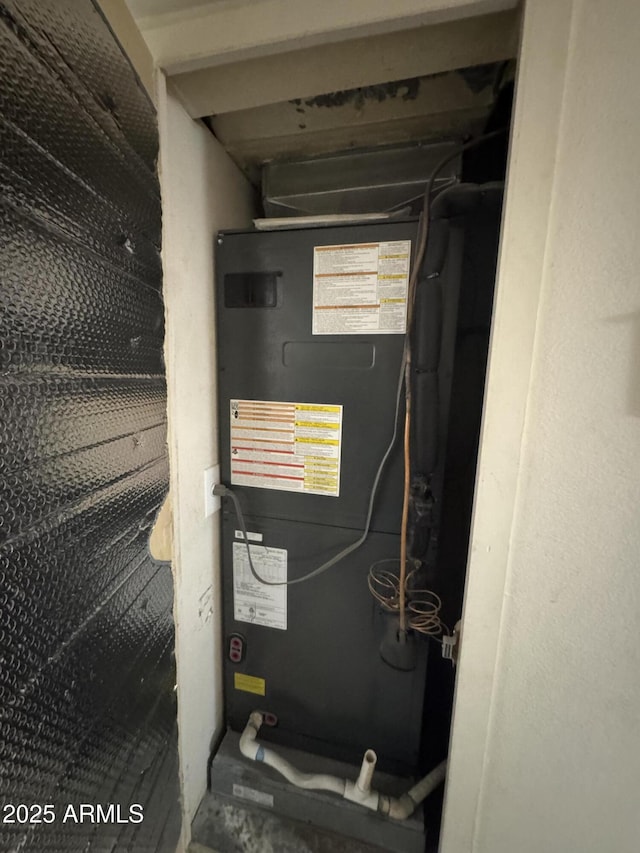 utility room with heating unit