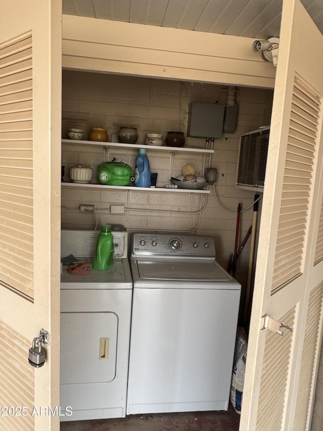 clothes washing area featuring laundry area and washer and dryer